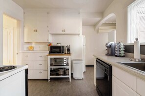 Microwave, dishwasher, coffee/tea maker, cookware/dishes/utensils