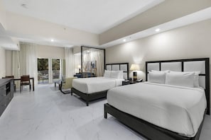 A hotel room with two beds, a dining area, and a balcony with curtains. - Studio for 4, Downtown Doral, Kitchen & Lanai (Miami)