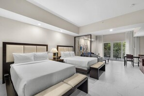 A hotel room with two beds, a balcony, and a dining area. - Rain Shower and Jet Tub, Full Kitchen, Living Area (Miami)
