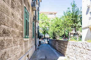 Stroll through this historic urban alleyway, lined with traditional buildings leading to a charming courtyard.