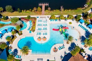 An aerial view of a resort with a large central pool, multiple smaller pools, and a variety of lounge areas. - Free Water Park Private Pool and Lakeview (Kissimmee)