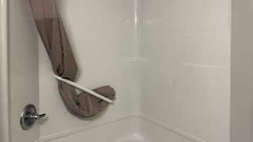 Combined shower/bathtub, towels, soap, toilet paper