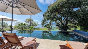 Outdoor pool, pool umbrellas, pool loungers