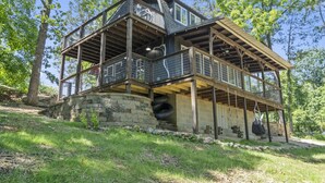 A multi-level wooden cabin with balconies, surrounded by trees. - No Regrets at the North Fork River (Dawt)
