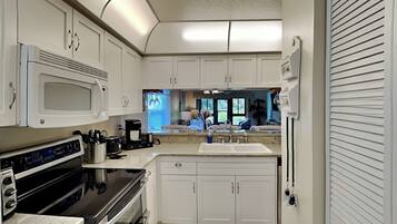 Condo, Multiple Beds, Patio, Garden View (Bouchelle Island 101) | Private kitchen | Coffee/tea maker