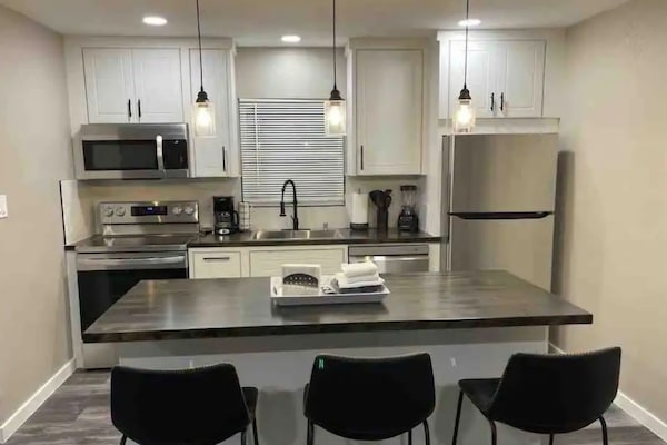 Mini-fridge, stovetop, cookware/dishes/utensils, spices