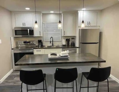 Mini-fridge, stovetop, cookware/dishes/utensils, spices. High Plains Lodge at Nomad Landing