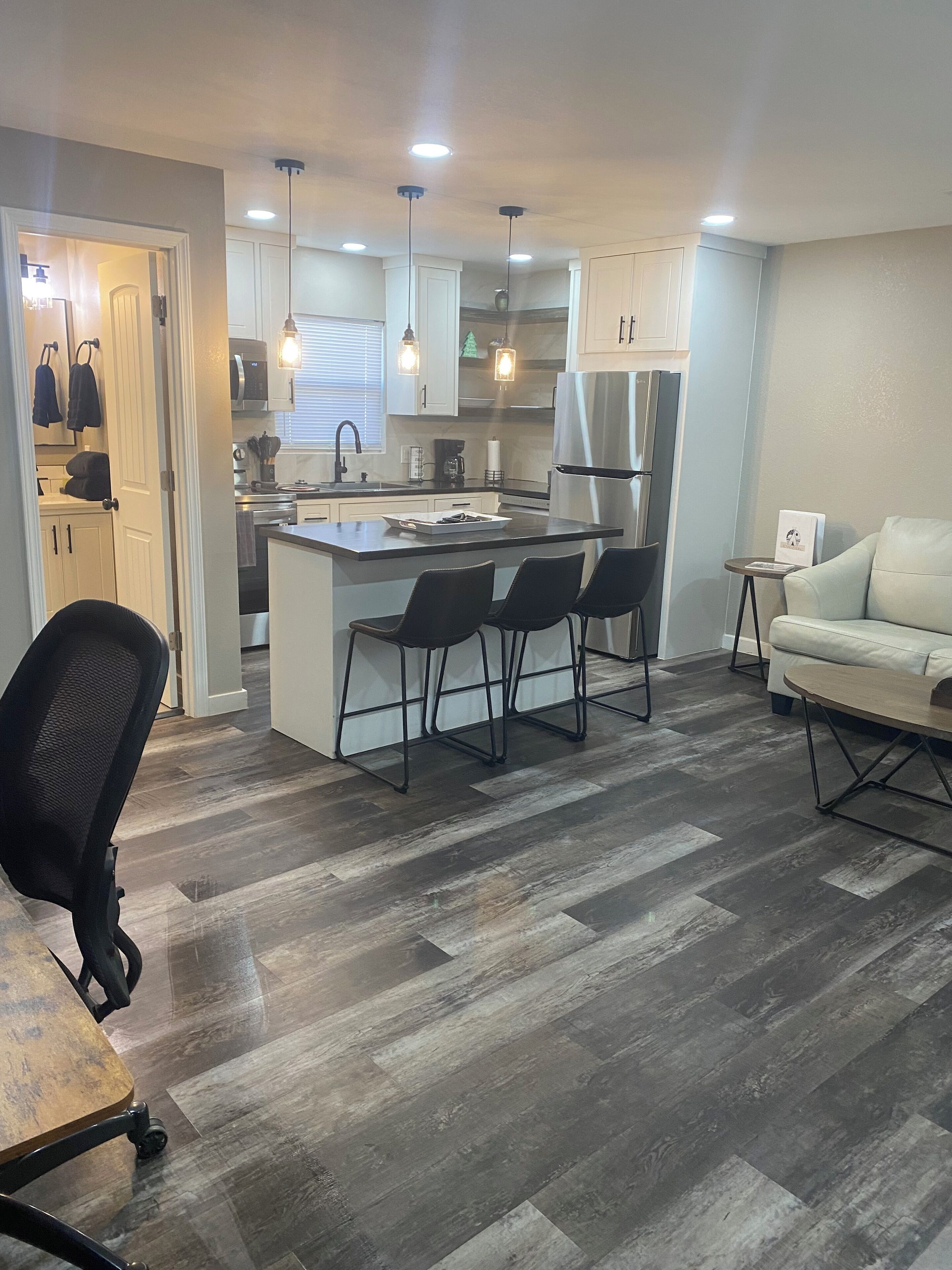 Family Suite, 1 Bedroom | Living area | 50-inch Smart TV with digital channels