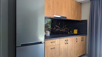 Fridge, coffee/tea maker, toaster, cookware/dishes/utensils
