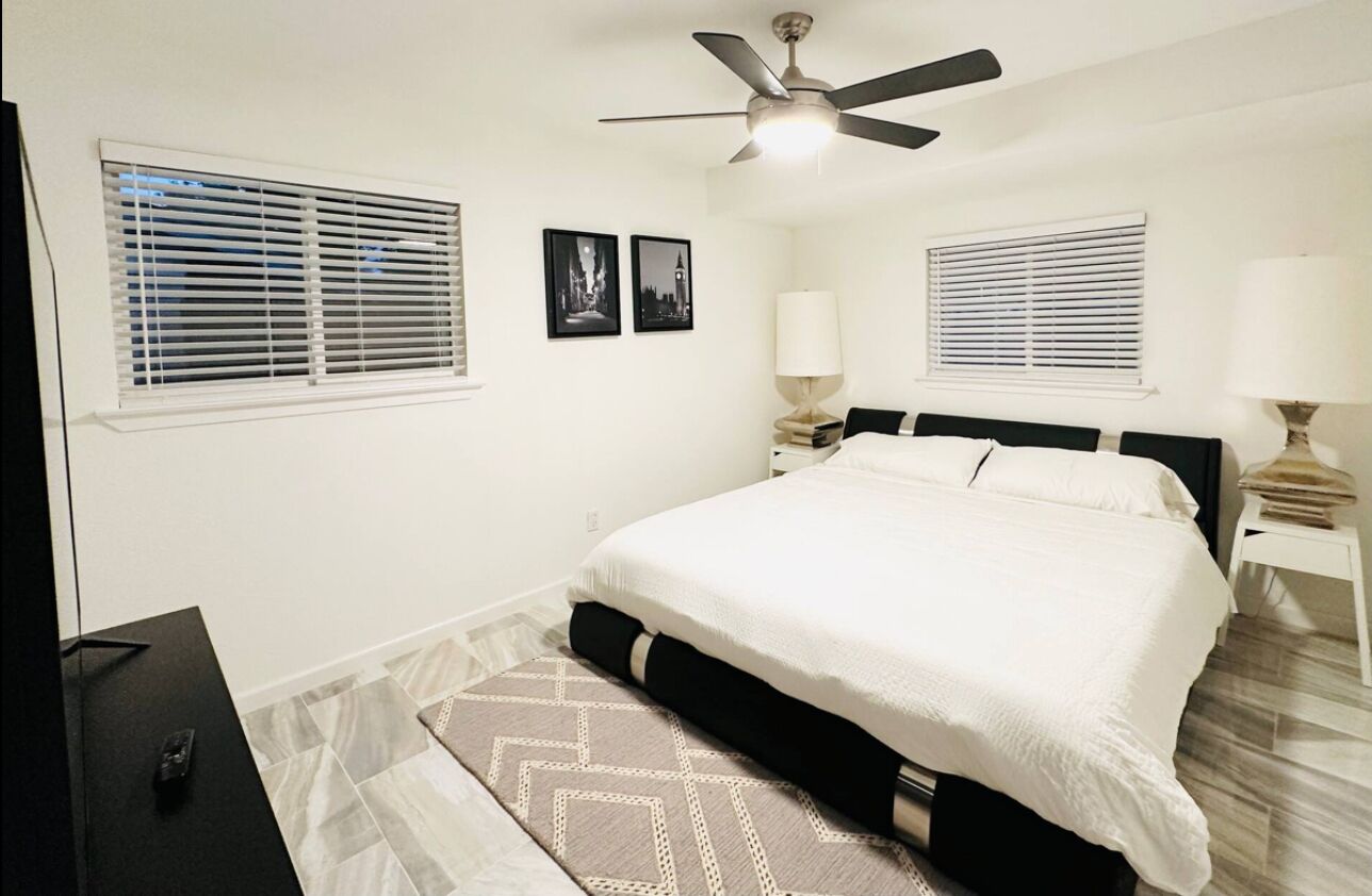 King bedroom with  65 in TV