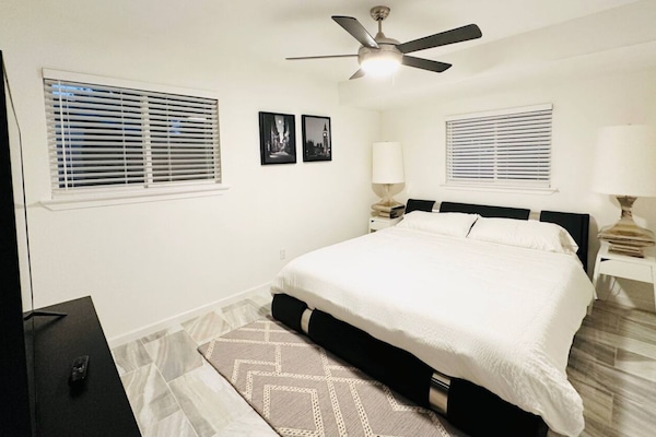 King bedroom with 65 in TV