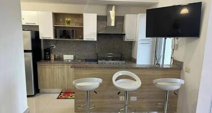 Cozy 2-bedroom condo with WiFi, fitness room and pool in tranquil Boca Chica