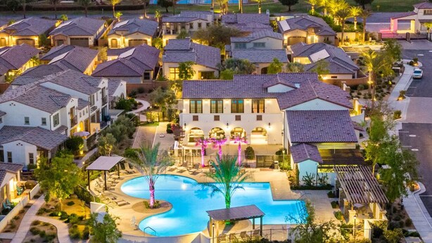 A residential area with houses, a swimming pool, and a well-lit street. - End of Summer Golf Getaway | PGA West | Golf Cart (La Quinta)