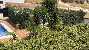 A villa with a swimming pool, surrounded by lush greenery and a view of a hilly landscape. - Lovely 10-bed Villa With Private Pool & Garden (Cacin)