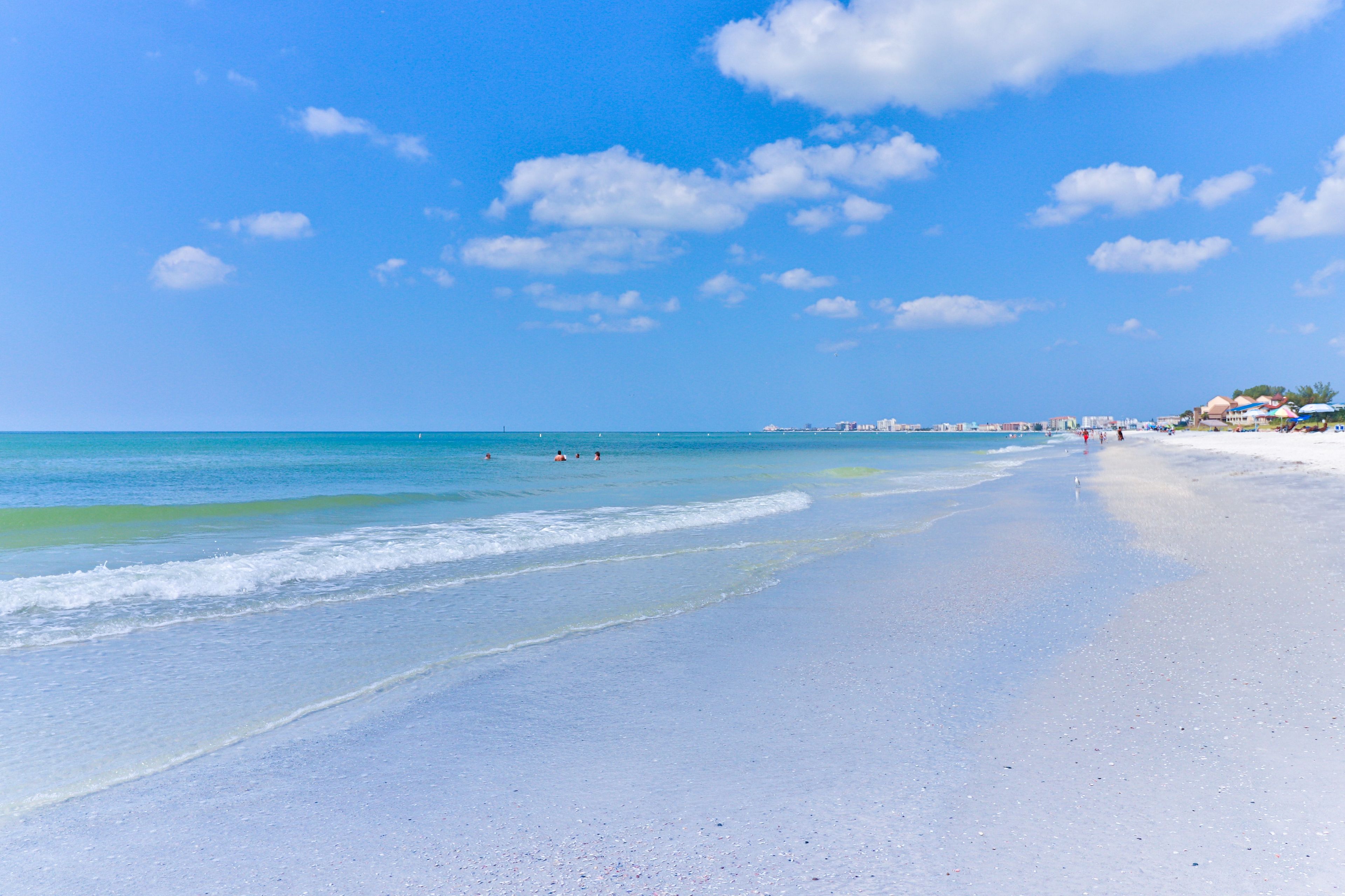 A beach with clear skies and calm waters.