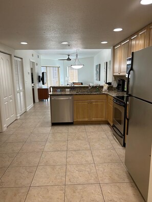 Fridge, microwave, oven, stovetop - Beach Bliss: 2BR Condo with Pool & Parking (Treasure Island)