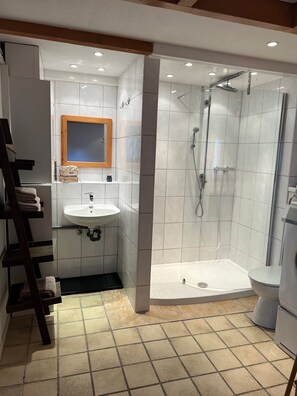 Shower, hair dryer, towels, soap