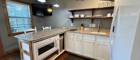 Fridge, microwave, coffee/tea maker, toaster