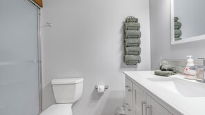 Shower, hair dryer, towels, soap
