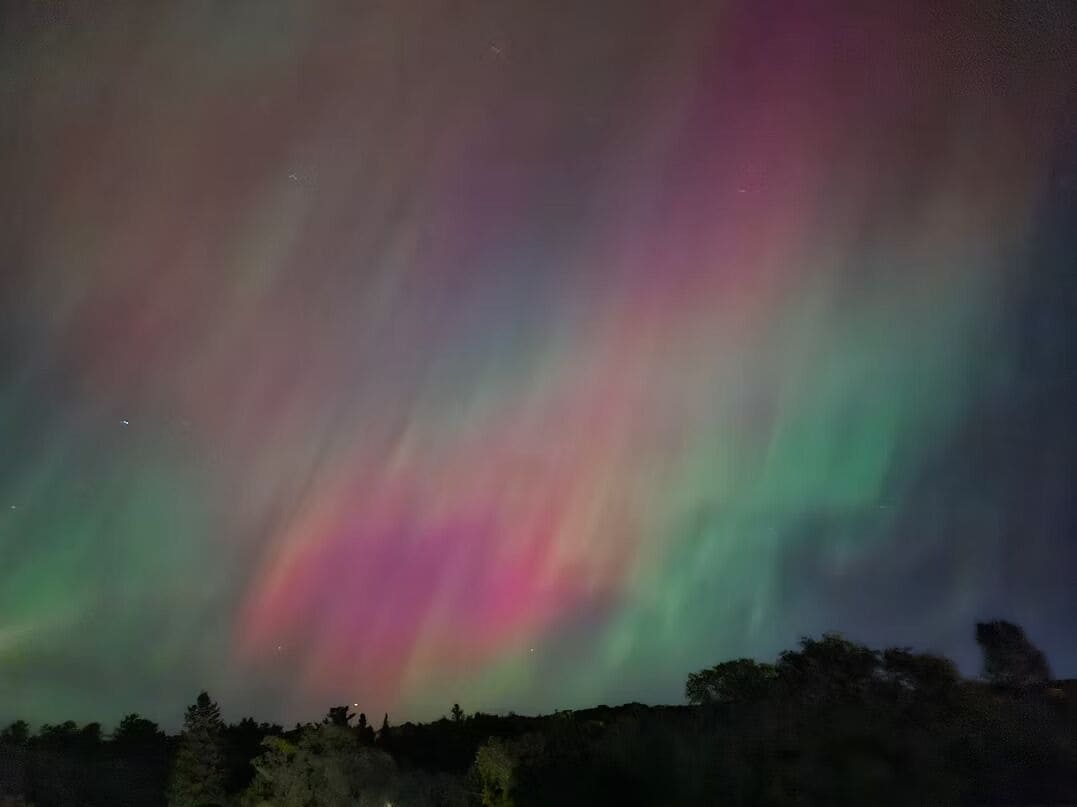 A night sky with the aurora borealis.