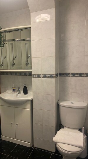 Shower, hair dryer, towels, soap