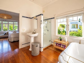 Shower, hair dryer, towels, shampoo