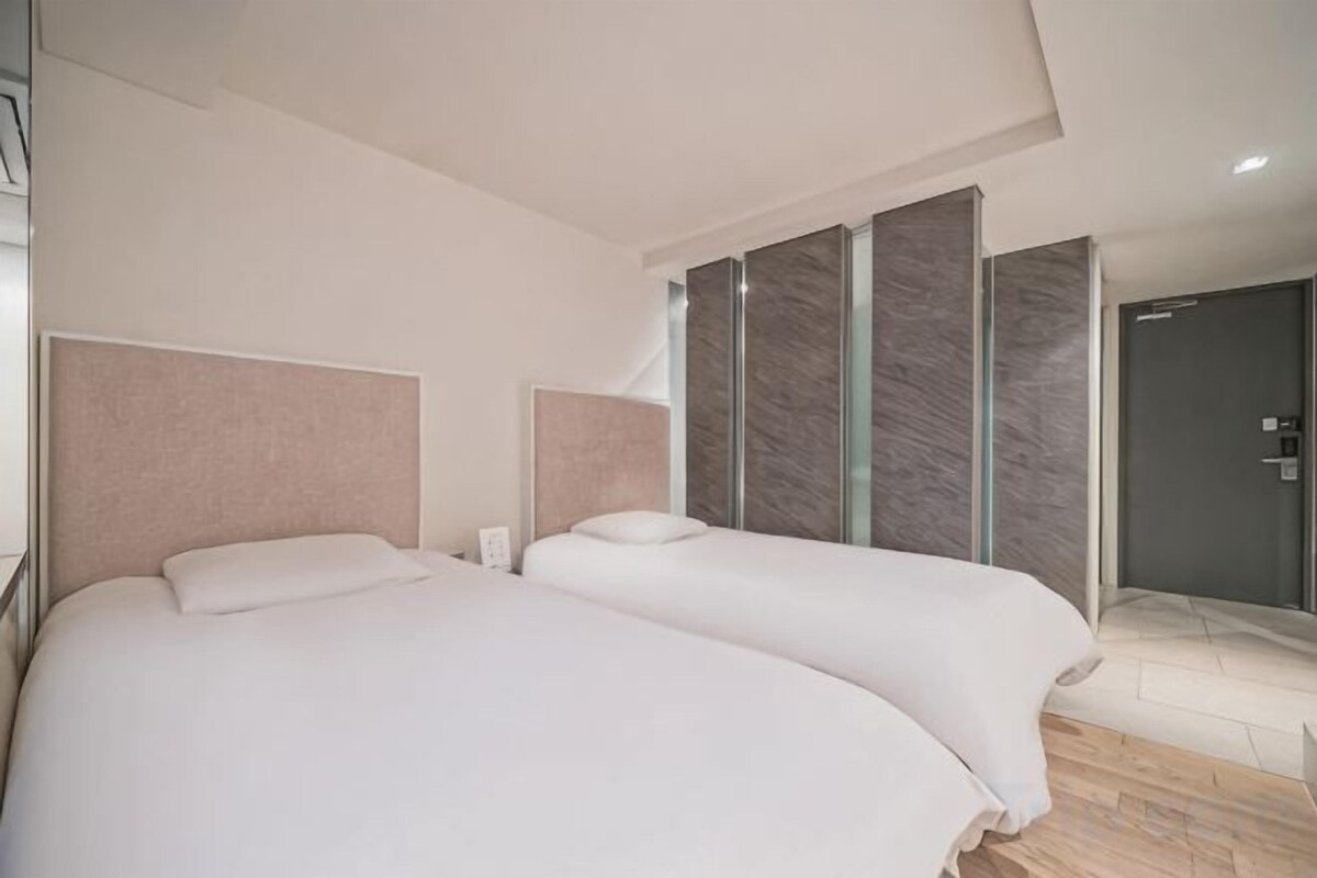 Premium bedding, blackout drapes, soundproofing, WiFi (free)