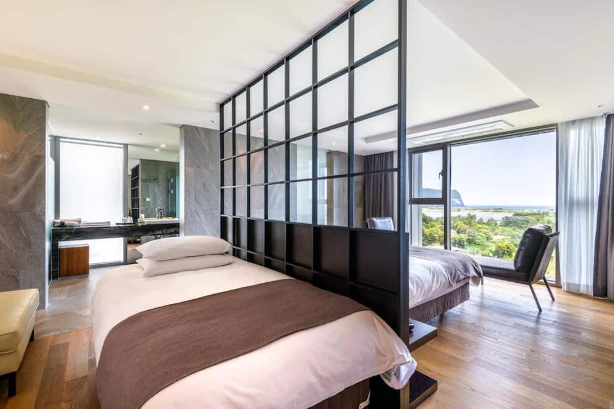 Premium bedding, laptop workspace, blackout curtains, soundproofing