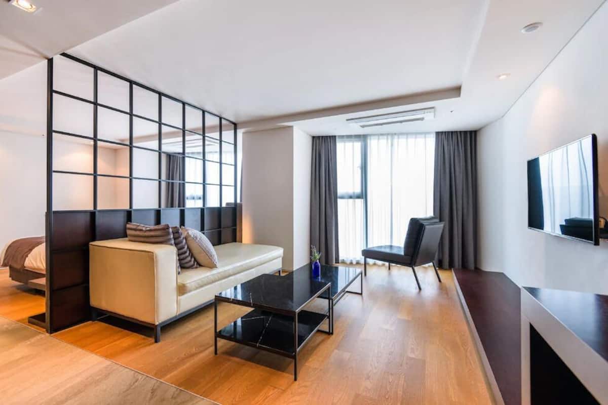 Premium Suite | Premium bedding, laptop workspace, blackout curtains, soundproofing