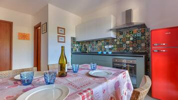 Fridge, stovetop, coffee/tea maker, cookware/dishes/utensils