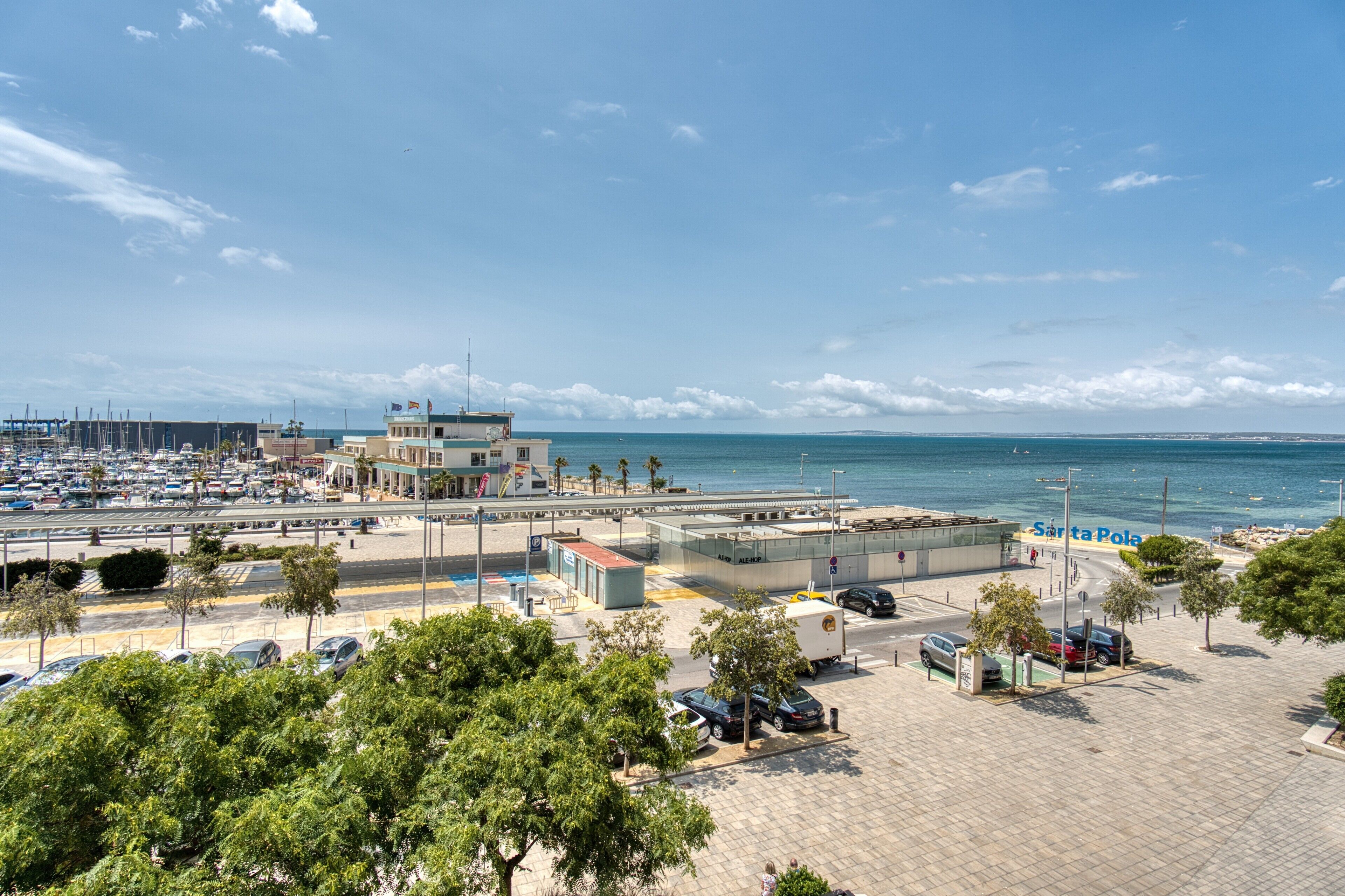 A coastal area with a marina, a building labeled 'SANTA POLA,' and a parking lot.