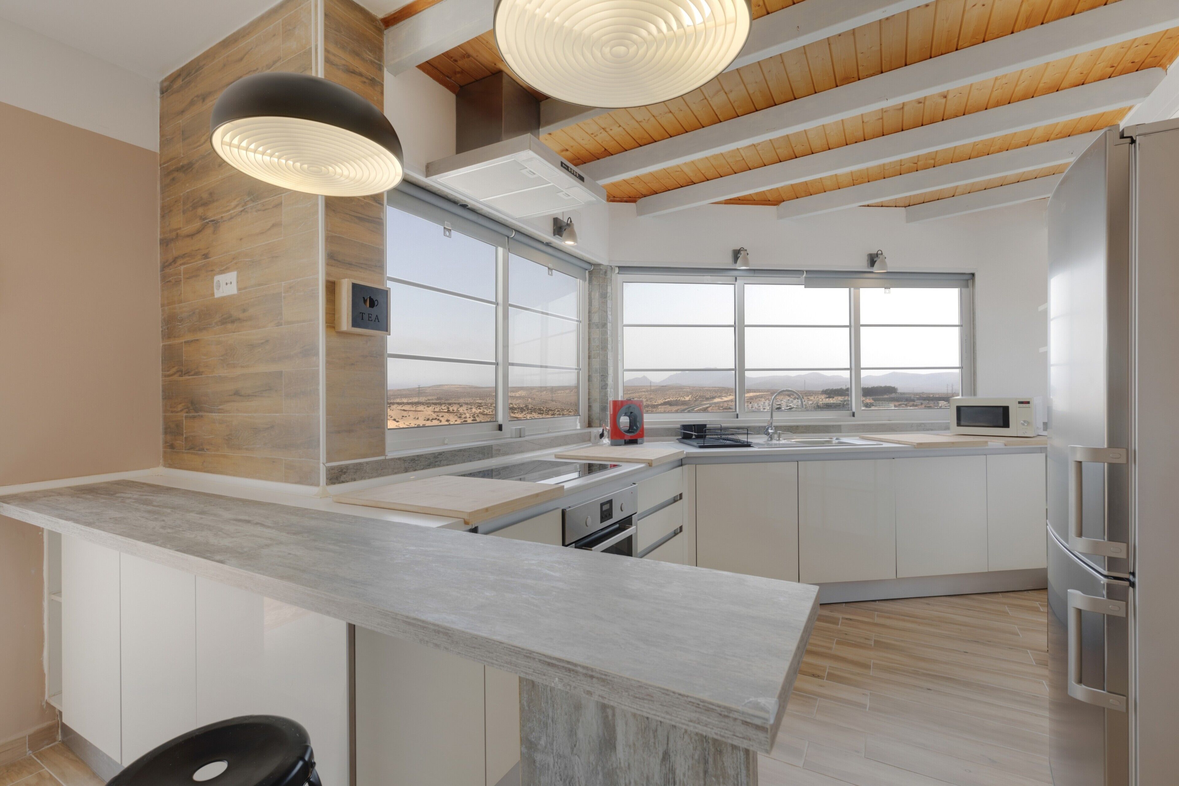 Fridge, microwave, coffee/tea maker, cookware/dishes/utensils