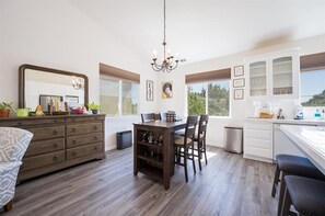 Enjoy meals at the large dining table with comfortable chairs, and make use of the cabinet and sink.