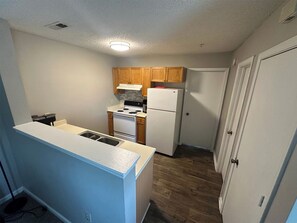 Fridge, stovetop, dishwasher, coffee/tea maker