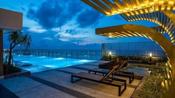 2 outdoor pools, open 6:00 AM to 9:00 PM, pool loungers