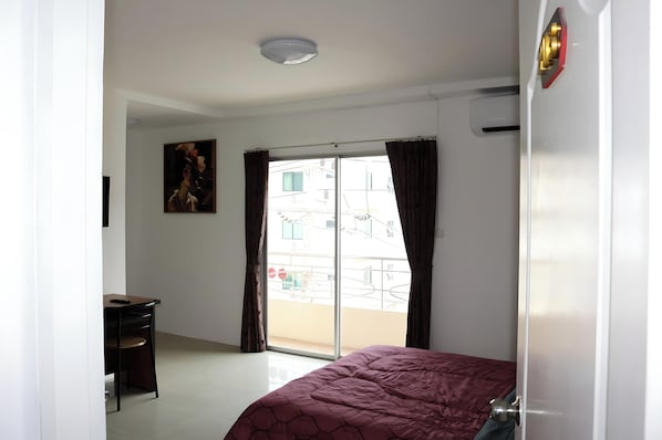 Deluxe Room, Balcony, City View | In-room safe, individually furnished, desk, laptop workspace