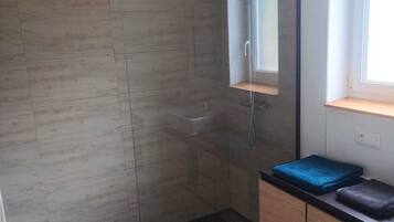 Shower, towels, soap, shampoo