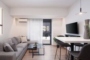 Deluxe Apartment, 1 Bedroom, Jetted Tub, City View | Living room - Kosmos Luxury Residences (Athens)
