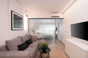 Standard Apartment | Living area | 47-inch TV with cable channels - Kosmos Luxury Residences (Athens)