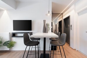 Deluxe Apartment, 1 Bedroom, Jetted Tub, City View | Dining room - Kosmos Luxury Residences (Athens)