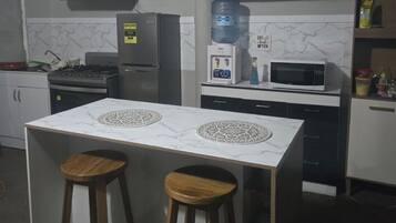 Microwave, stovetop, coffee/tea maker, cookware/dishes/utensils