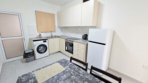 Standard Apartment | Private kitchen | Fridge, microwave, oven, stovetop