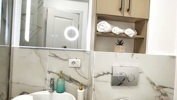Hair dryer, towels, soap, shampoo