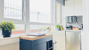 Fridge, microwave, electric kettle, cookware/dishes/utensils