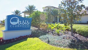 A sign for Oasis Clubhouse at ChampionsGate. - 8955-Luxury 5BR Home at Champions Gate Resort (Davenport)