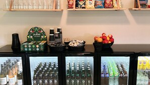 A beverage display with various drinks and snacks. - Skovly (Viborg)