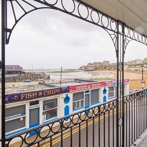 A seaside food stall with a sign for 'Fish & Chips' and 'Sweets & Treats'. - Host Stay Ancient Lights (Broadstairs)
