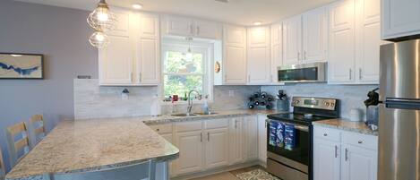 Fridge, microwave, stovetop, cookware/dishes/utensils
