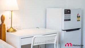 A white desk with a lamp, a white chair, and a white refrigerator with a digital control panel. - Metawise/parramatta Cozy Room With Furniture Wifi (Parramatta)