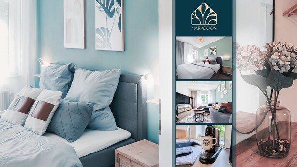 A modern bedroom with a bed, bedside table, and a vase with flowers. - Garden View 1 - Design-Apartment, Küche, Garten - Sauerlanda (Schalksmühle)
